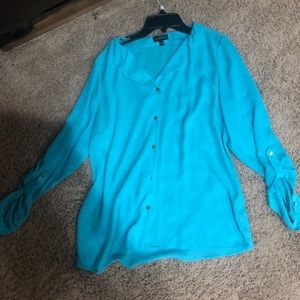 The limited blue button down top